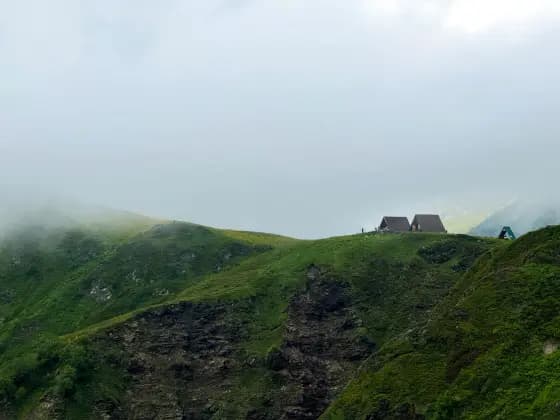 The cliff edge of the cornice in fog
